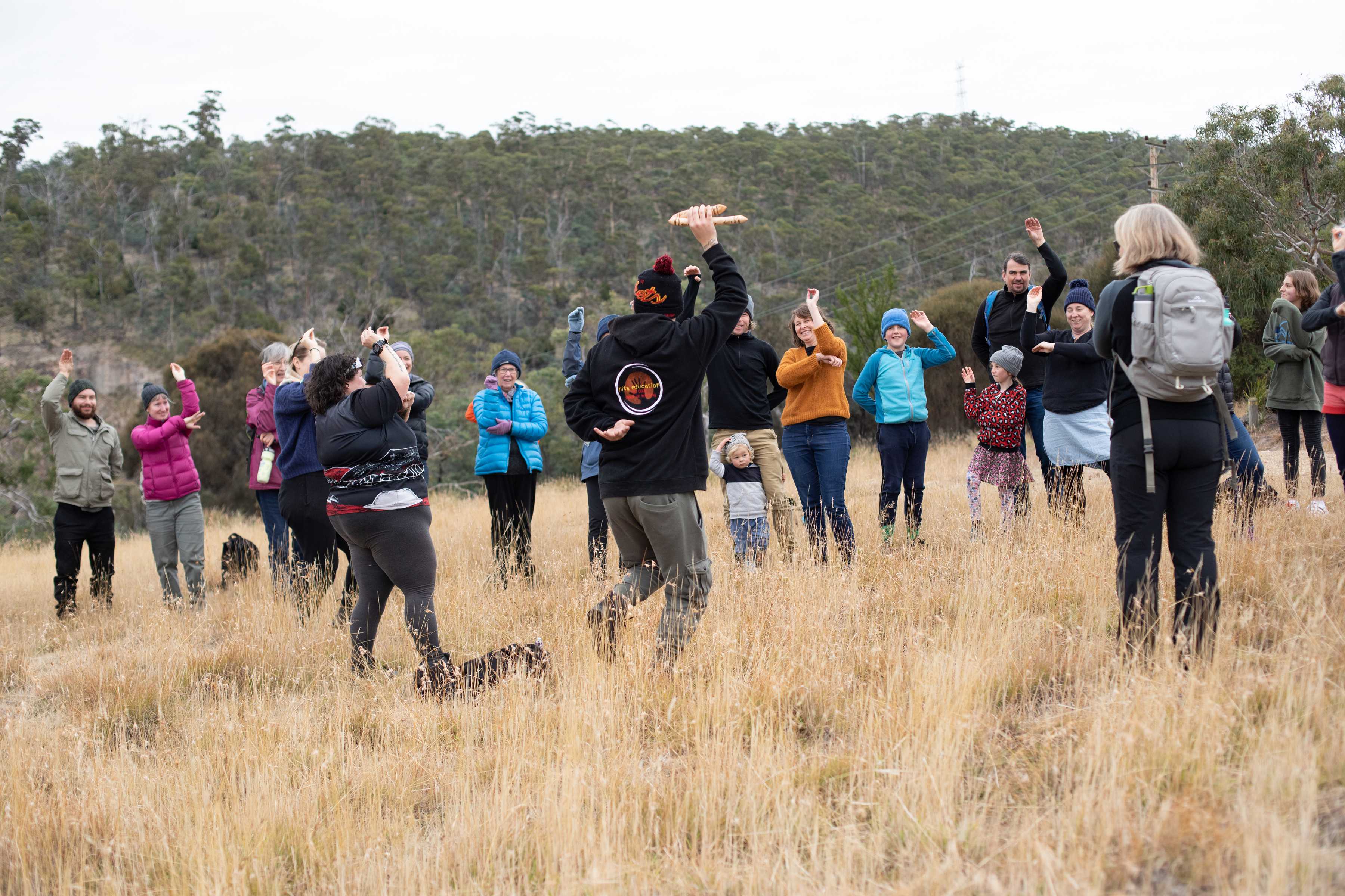 The Clarence Climate Action group do the emu dance as part of their Connecting to Country excursion. Photo: Kieran Bradley.